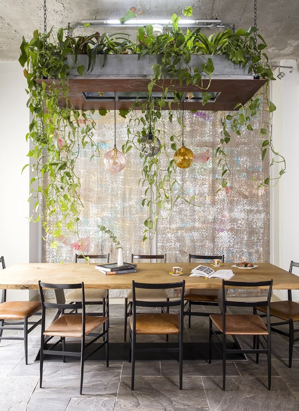Avant garde Industrial Mews House | Hanging garden in dining area | Interior Designers